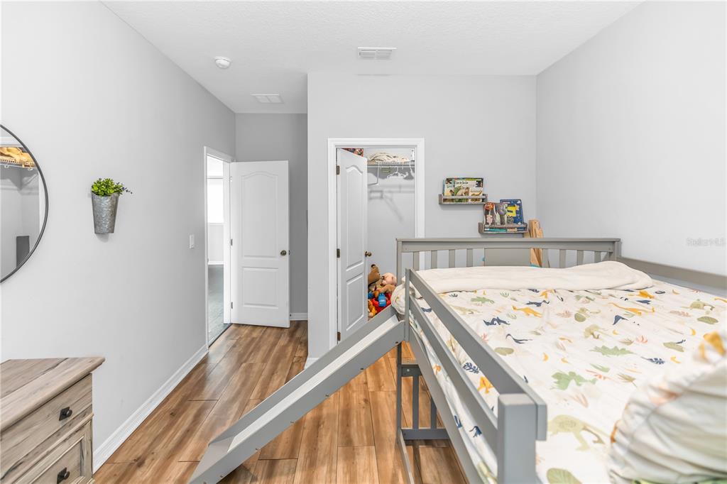 239 Lugano Way DeBary, FL 32713 - Photo 35 of 52 a view of a hallway with a bedroom