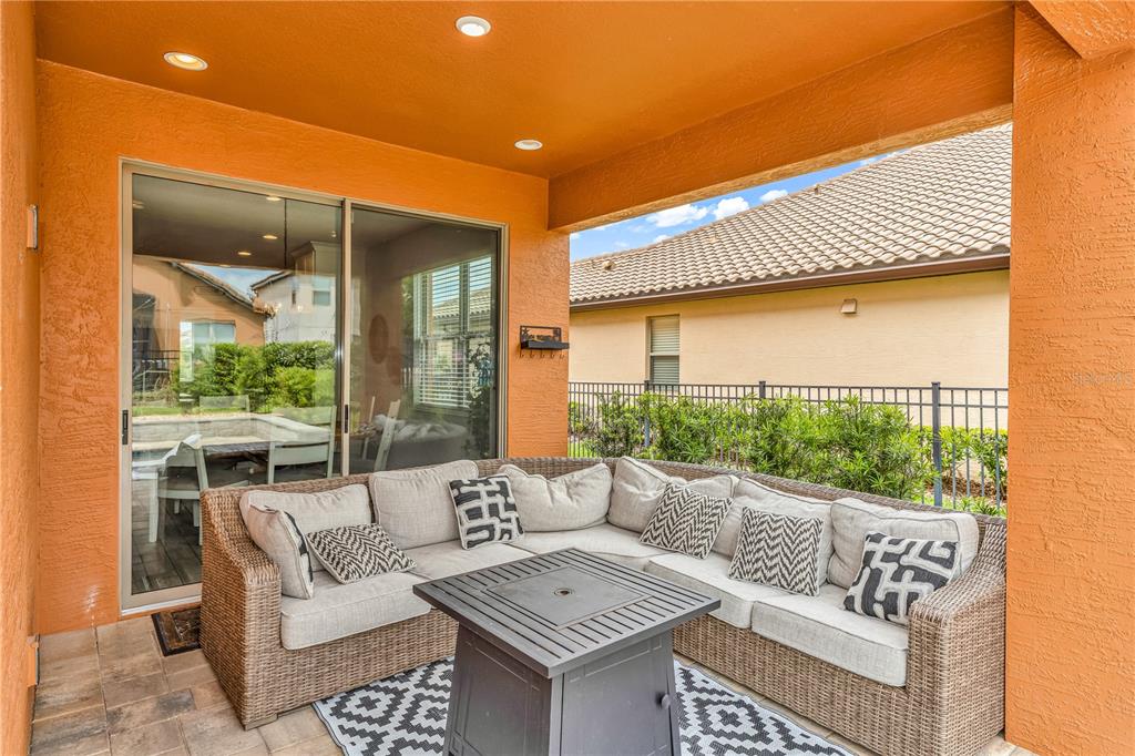 239 Lugano Way DeBary, FL 32713 - Photo 43 of 52 a outdoor living space with furniture and a potted plant