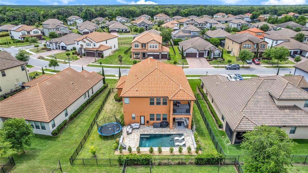 239 Lugano Way DeBary, FL 32713 - Photo 47 of 52 an aerial view of multiple houses with yard