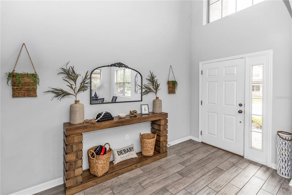 239 Lugano Way DeBary, FL 32713 - Photo 6 of 52 a view of living room and wooden floor