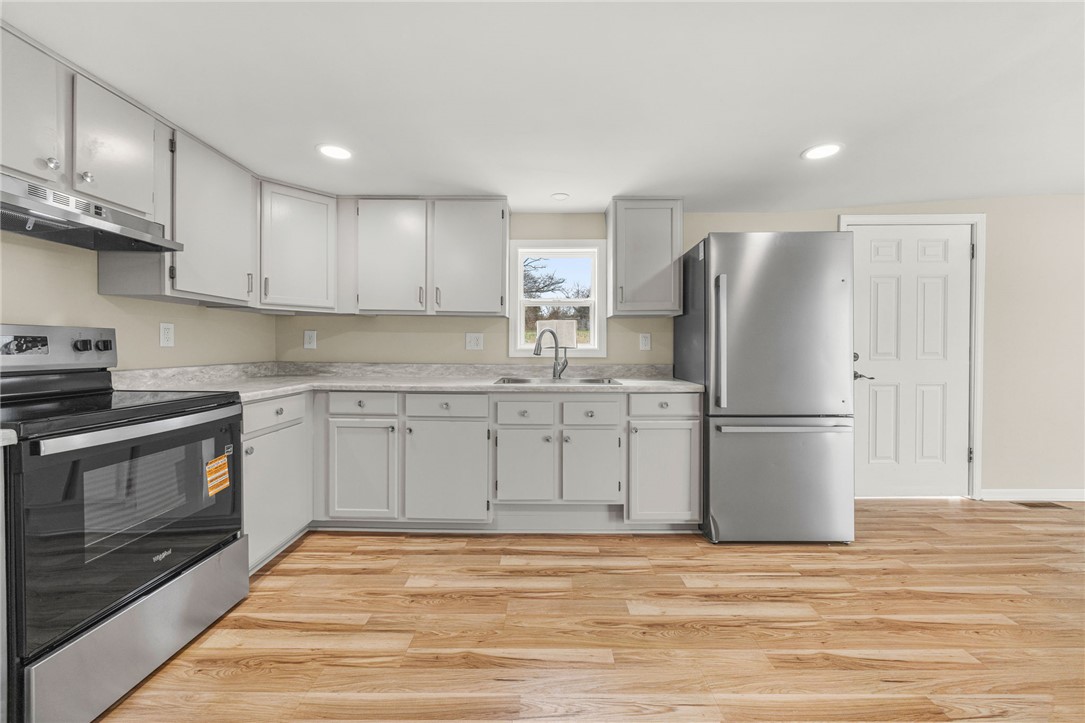 139 Davis Road Easley, SC 29640 - Photo 12 of 34 This bright kitchen features modern appliances and ample cabinet space, perfect for culinary endeavors.