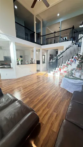 a view of a living room and wooden floor