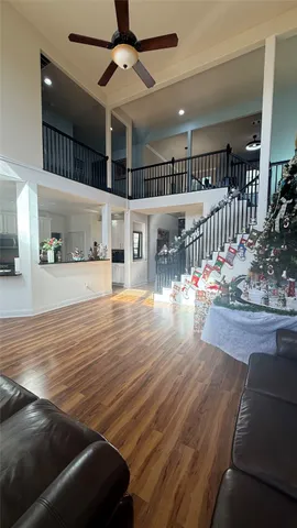 a kitchen with kitchen island granite countertop a stove top oven a sink a counter top space and cabinets