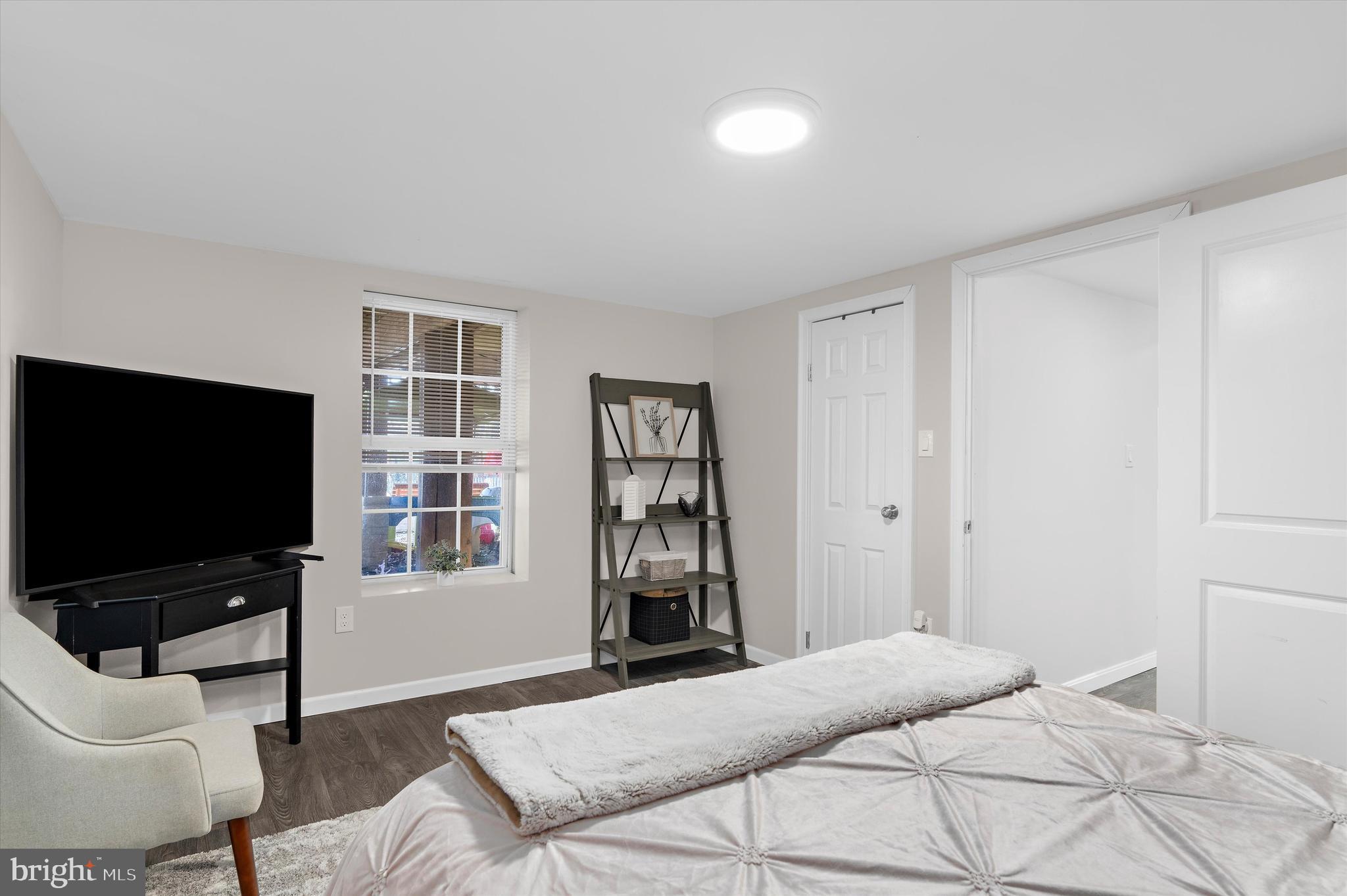 13159 Partridge Berry Court Waldorf, MD 20601 - Photo 47 of 63 a bedroom with a bed and a flat screen tv