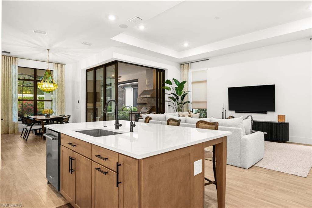 9565 Caymas Terrace Naples, FL 34114 - Photo 17 of 47 a view of living room filled with furniture and flat screen tv