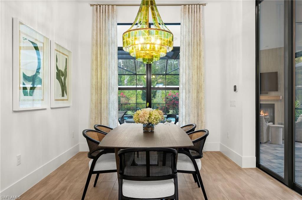 9565 Caymas Terrace Naples, FL 34114 - Photo 19 of 47 a dining room with furniture and window