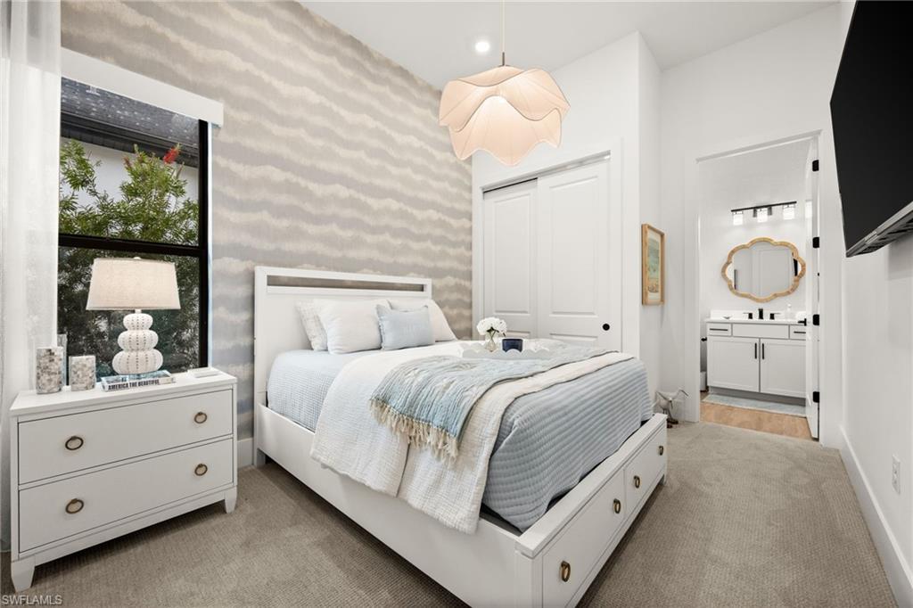 9565 Caymas Terrace Naples, FL 34114 - Photo 32 of 47 a bed room with a bed window and a television
