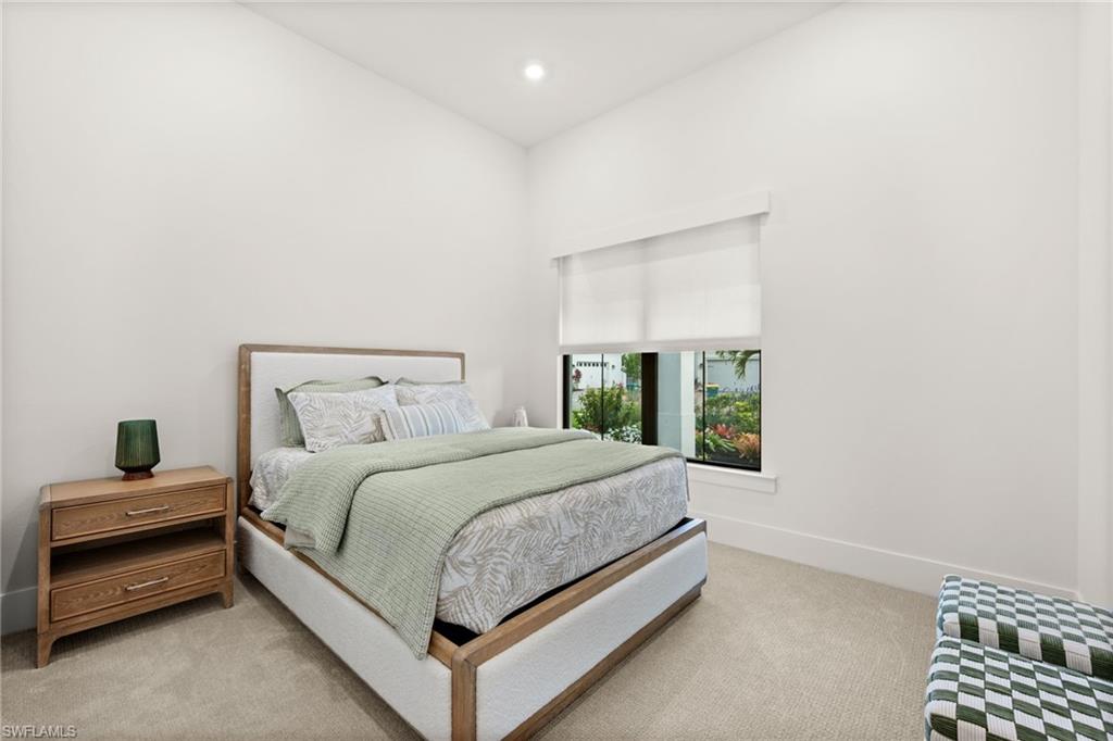 9565 Caymas Terrace Naples, FL 34114 - Photo 34 of 47 a bedroom with a bed and a window