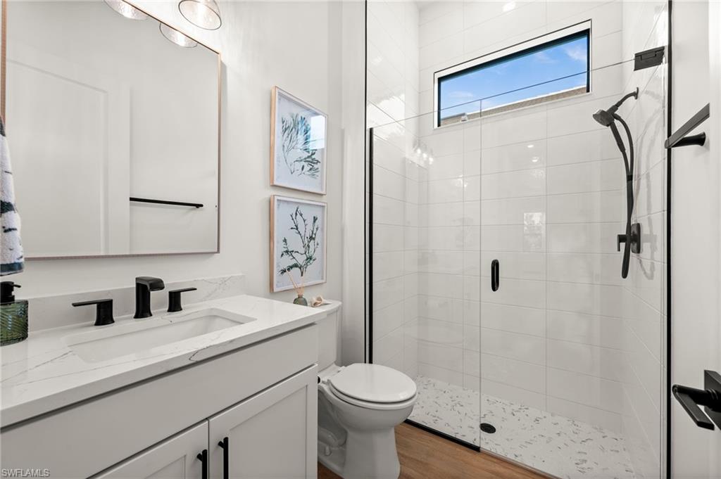 9565 Caymas Terrace Naples, FL 34114 - Photo 36 of 47 a bathroom with a sink toilet and shower