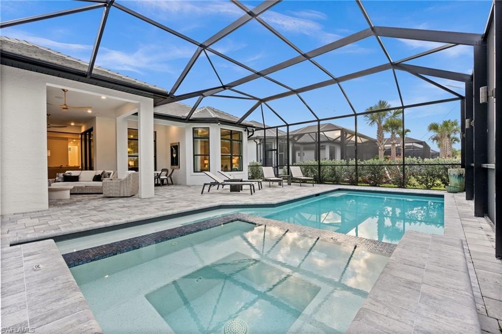 9565 Caymas Terrace Naples, FL 34114 - Photo 45 of 47 a view of a swimming pool with a patio