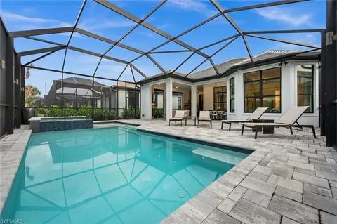 a view of a swimming pool with a patio