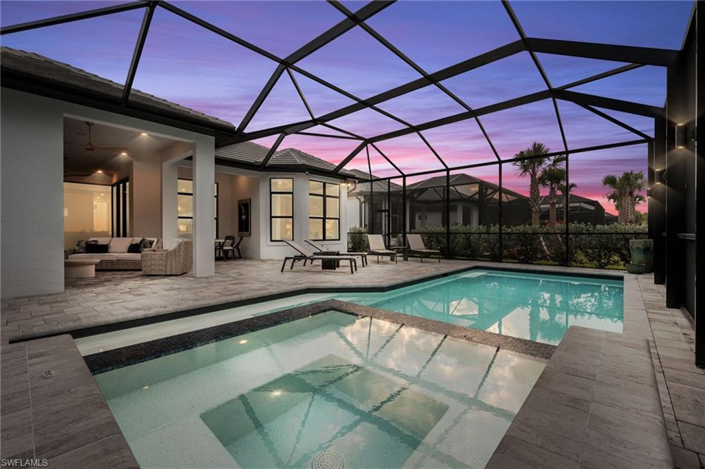 9565 Caymas Terrace Naples, FL 34114 - Photo 7 of 47 a view of a swimming pool with a patio