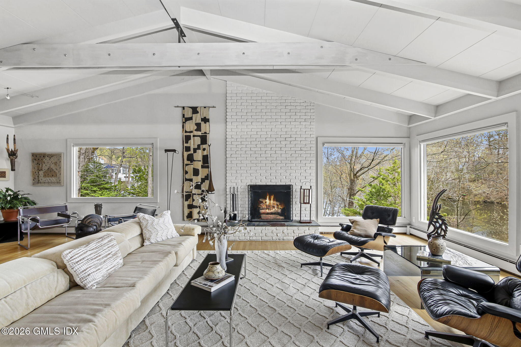 185 Valley Road Cos Cob, CT 06807 - Photo 12 of 38 a living room with furniture and a fireplace