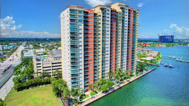 a front view of a building with a garden