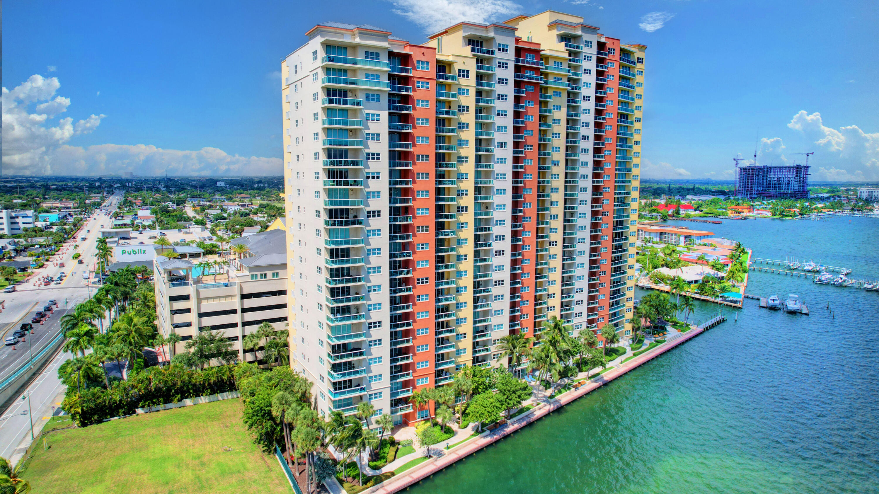 a front view of a building with a garden