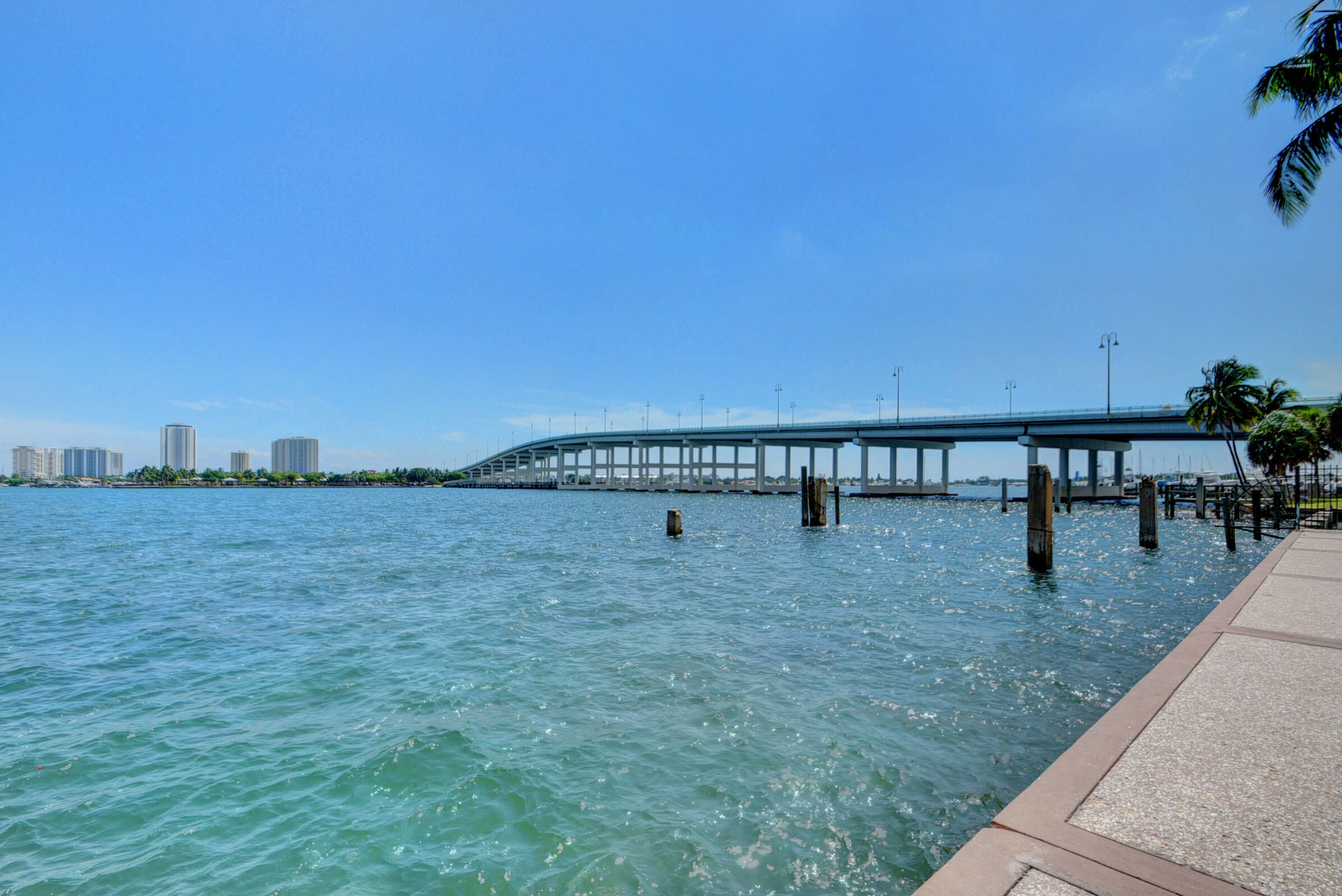 2640 Lake Shore Drive, Unit 115 Riviera Beach, FL 33404 - Photo 16 of 59 a view of a swimming pool with a lake