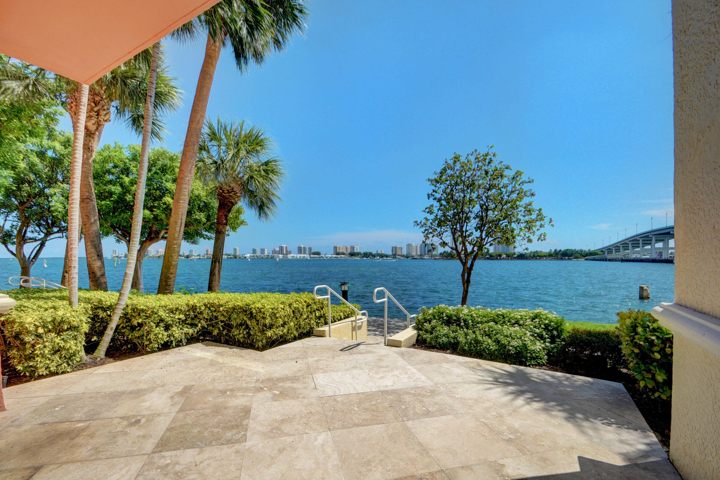 2640 Lake Shore Drive, Unit 115 Riviera Beach, FL 33404 - Photo 3 of 59 a view of a garden