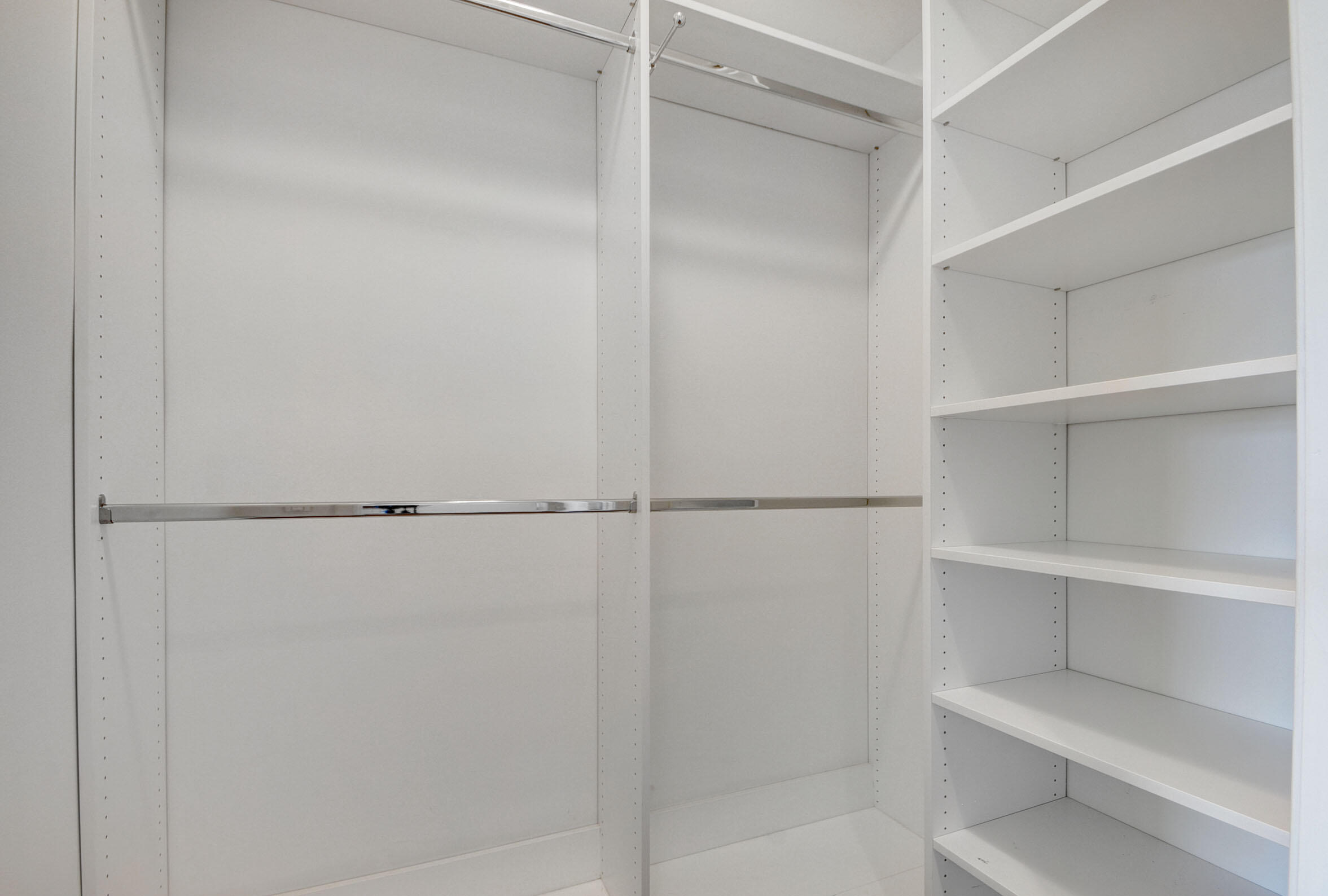 2640 Lake Shore Drive, Unit 115 Riviera Beach, FL 33404 - Photo 31 of 59 a view of an empty walk in closet