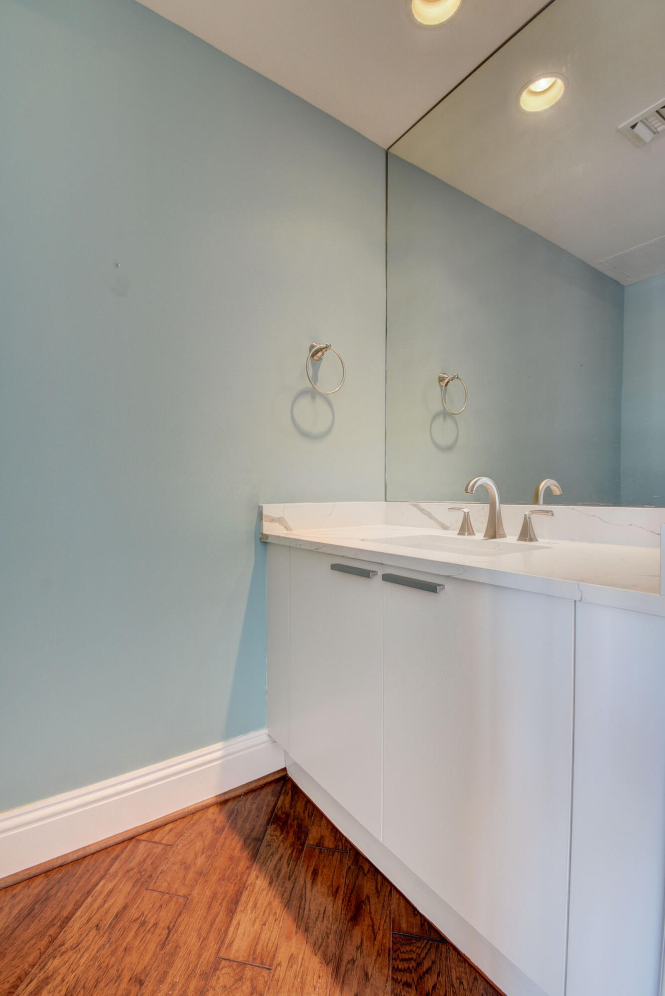 2640 Lake Shore Drive, Unit 115 Riviera Beach, FL 33404 - Photo 37 of 59 a bathroom with a sink and a mirror