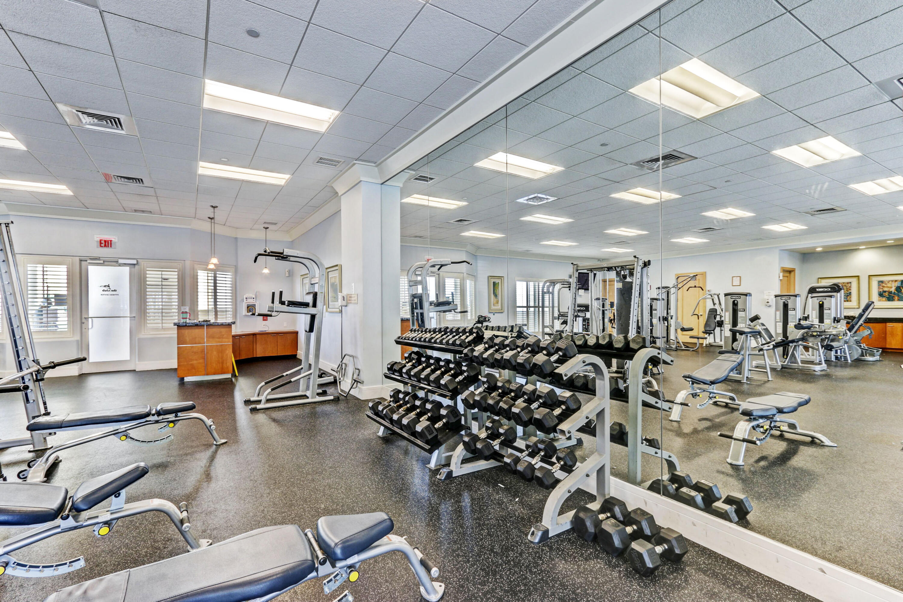 2640 Lake Shore Drive, Unit 115 Riviera Beach, FL 33404 - Photo 47 of 59 a room with gym equipment and a view of gym equipment