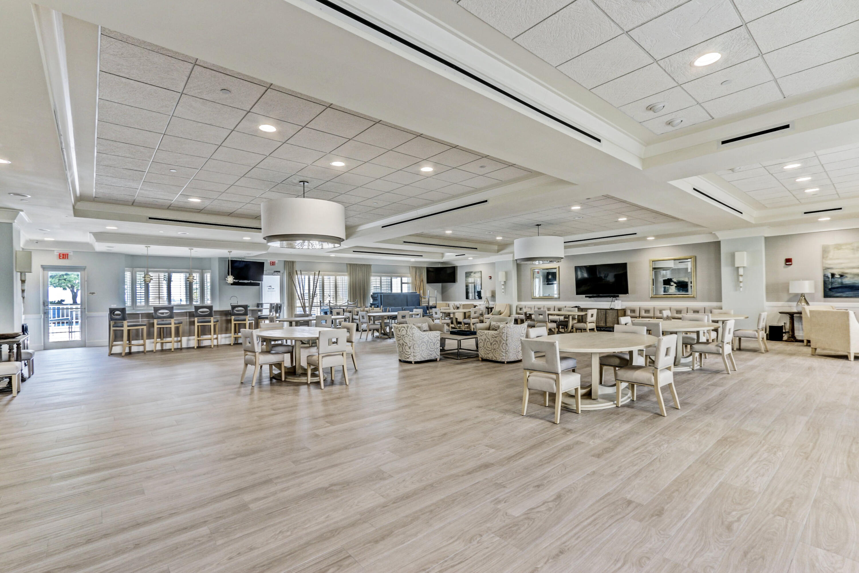 2640 Lake Shore Drive, Unit 115 Riviera Beach, FL 33404 - Photo 50 of 59 a view of a dining room with furniture window and wooden floor