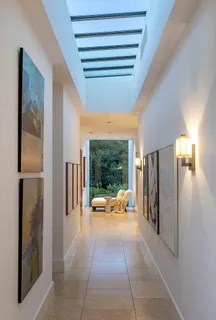 a lobby with furniture and mirror