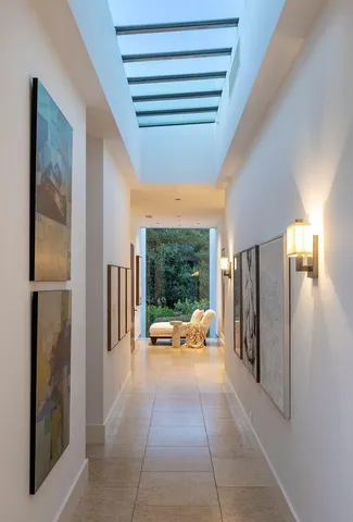 a kitchen with a sink a stove a dining table and chairs