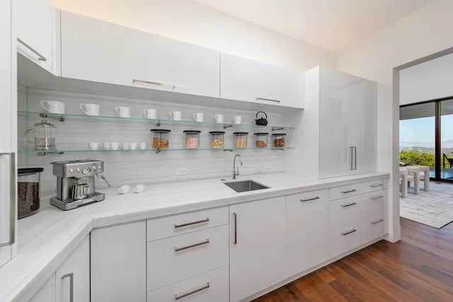 a room with pool table and a floor to ceiling window