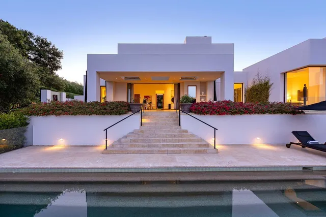 a view of a potted plants in front of house