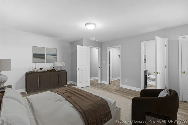 a bedroom with bed and furniture