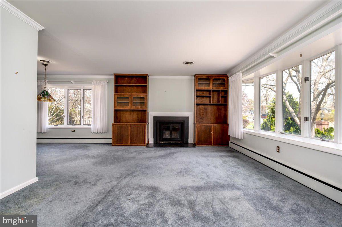 162 Sillery Bay Road Pasadena, MD 21122 - Photo 11 of 41 an empty room with windows and fireplace