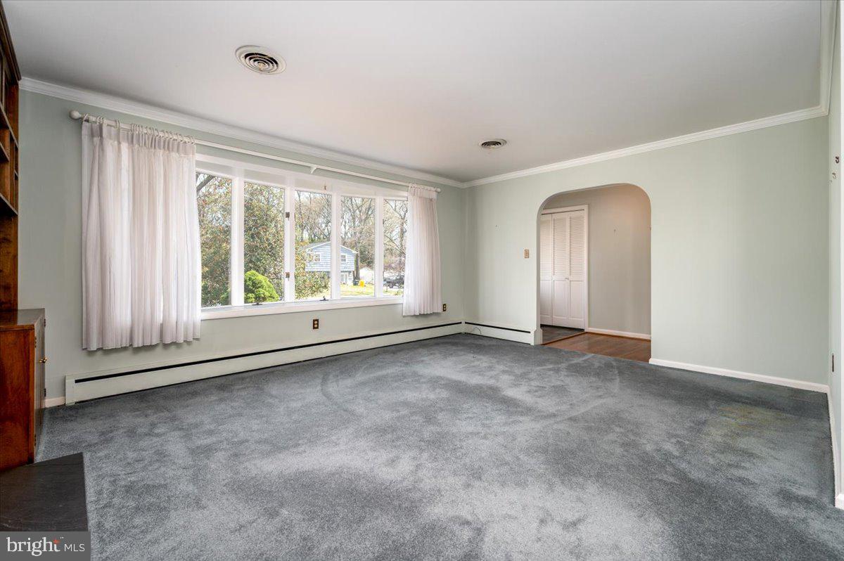 162 Sillery Bay Road Pasadena, MD 21122 - Photo 12 of 41 an empty room with large windows