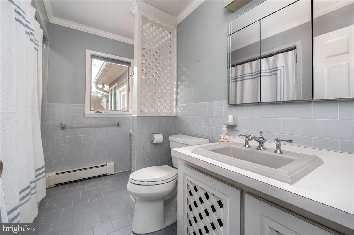 162 Sillery Bay Road Pasadena, MD 21122 - Photo 28 of 41 a bathroom with a sink and a toilet