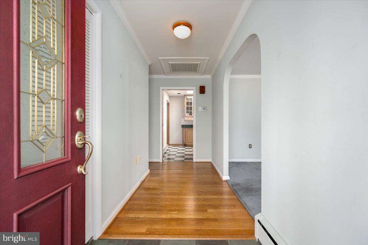 162 Sillery Bay Road Pasadena, MD 21122 - Photo 10 of 41 a view of a hallway with wooden floor and staircase