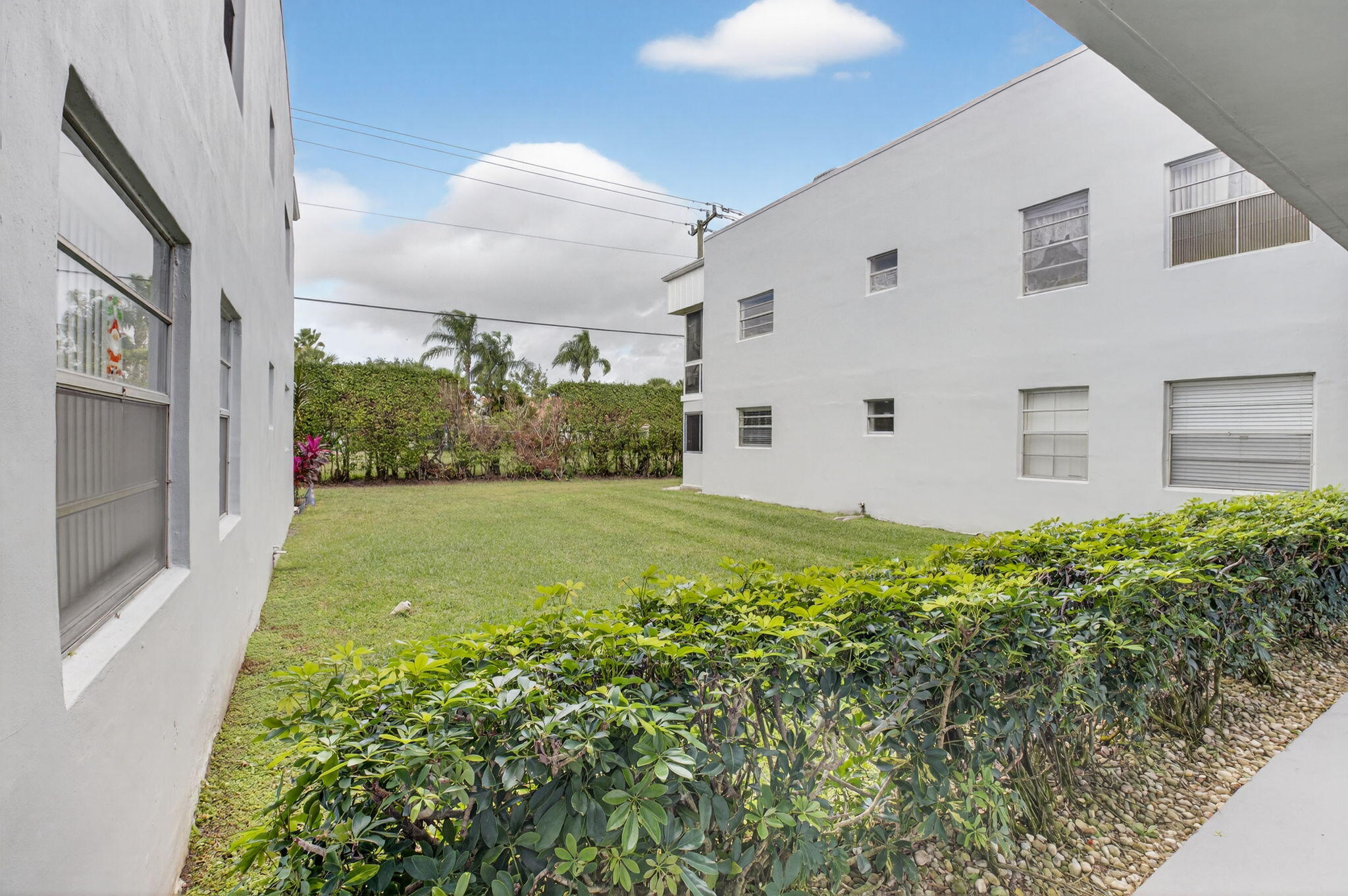 111 Normandy Lane Delray Beach, FL 33484 - Photo 10 of 14 a view of a back yard of the house