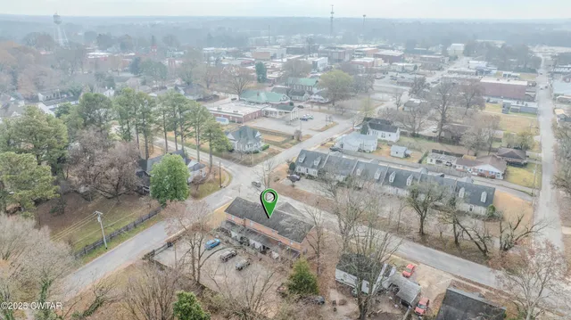 an aerial view of residential houses with outdoor space