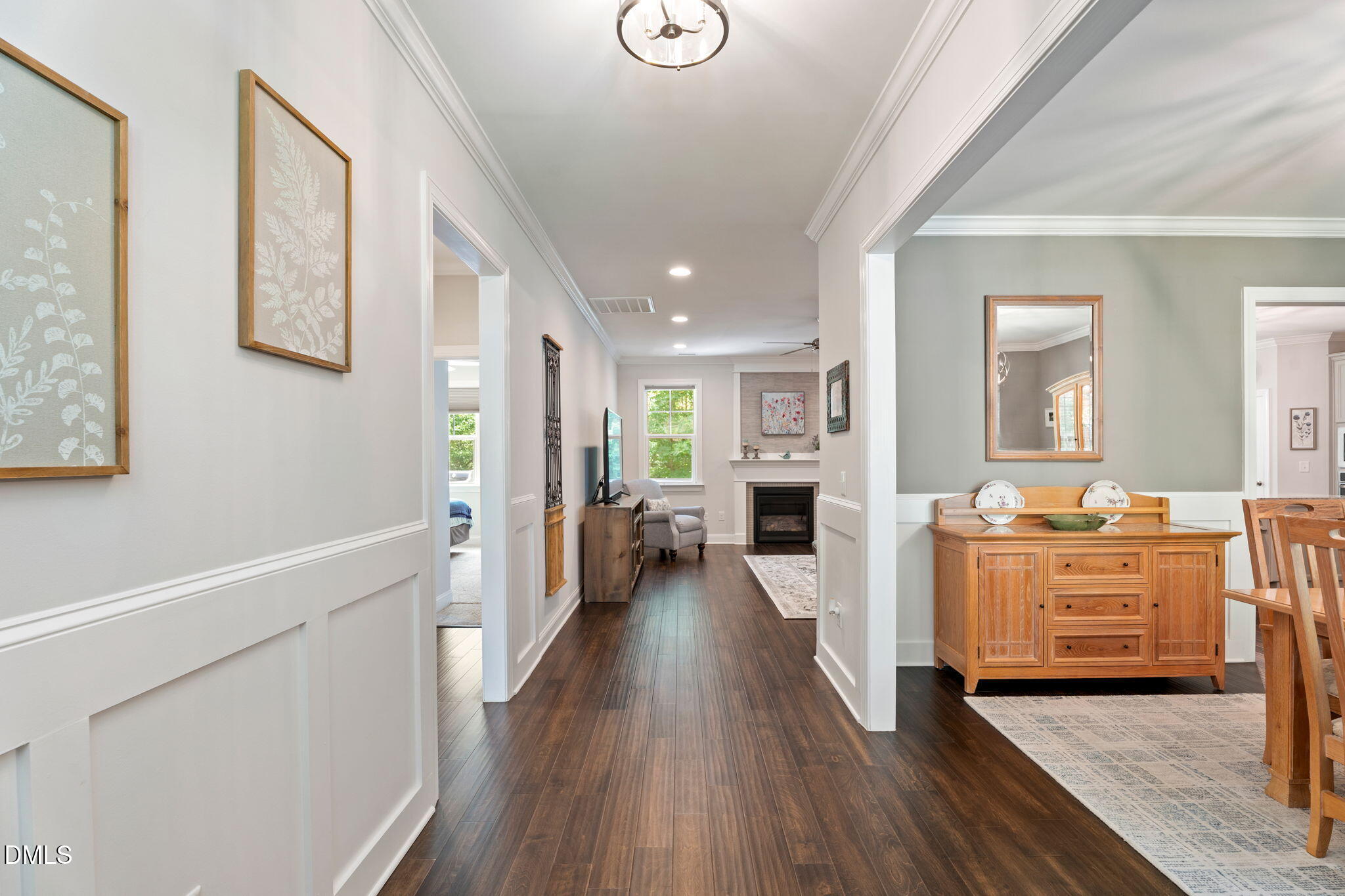 223 Colonial Ridge Drive Pittsboro, NC 27312 - Photo 4 of 47 a view of a living room kitchen with furniture and wooden floor