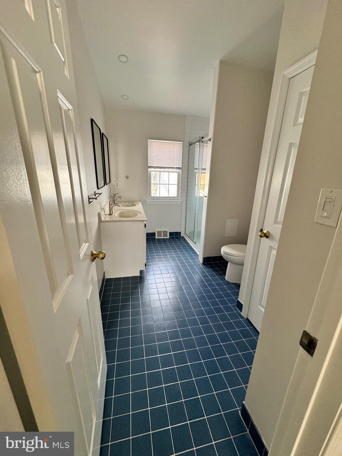 692 Danbury Court Newtown, PA 18940 - Photo 11 of 16 a bathroom with a sink and a mirror