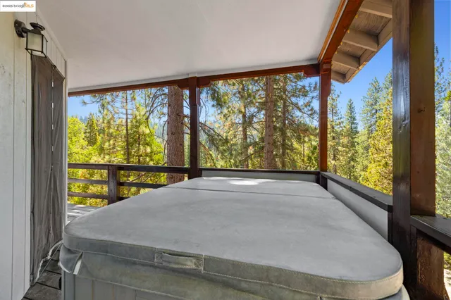 a view of porch and floor to ceiling window
