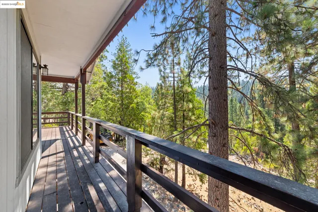 a view of balcony with wooden floor