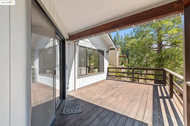 a view of two chairs in a balcony