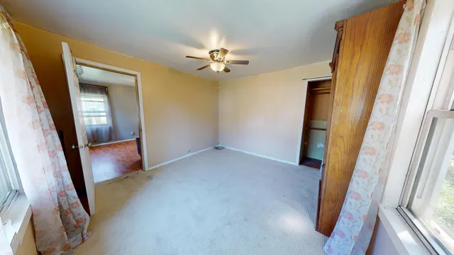 a view of an empty room with a fireplace