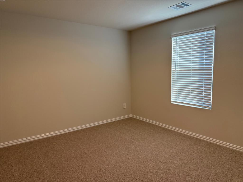 1736 Arches Road Anna, TX 75409 - Photo 16 of 18 Empty room with carpet floors and baseboards