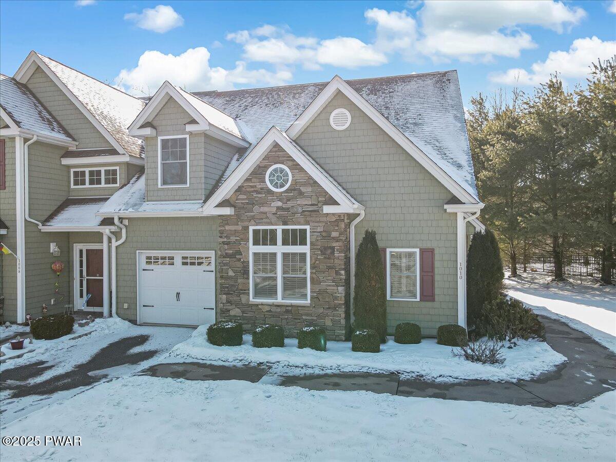 1010 MacIntosh Way Matamoras, PA 18336 - Photo 2 of 60 a front view of a house with a yard and garage