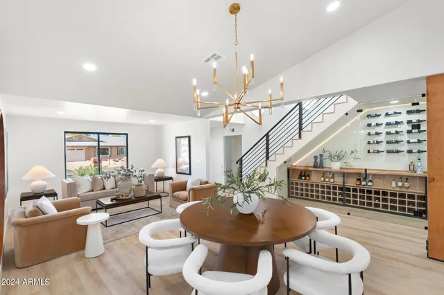 a view of a living room with kitchen
