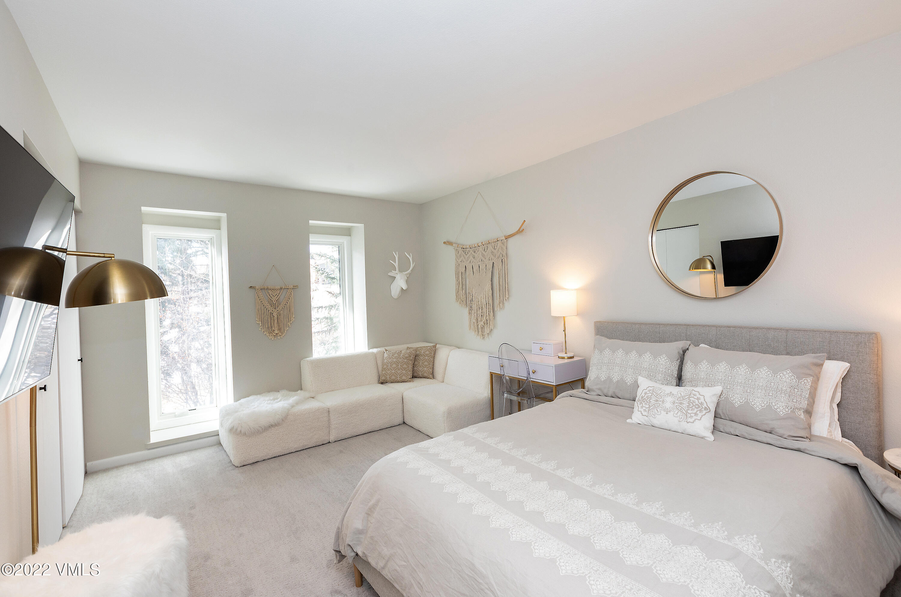 980 Vail View Drive, Unit 111B Vail, CO 81657 - Photo 11 of 17 a bedroom with bed and a large window