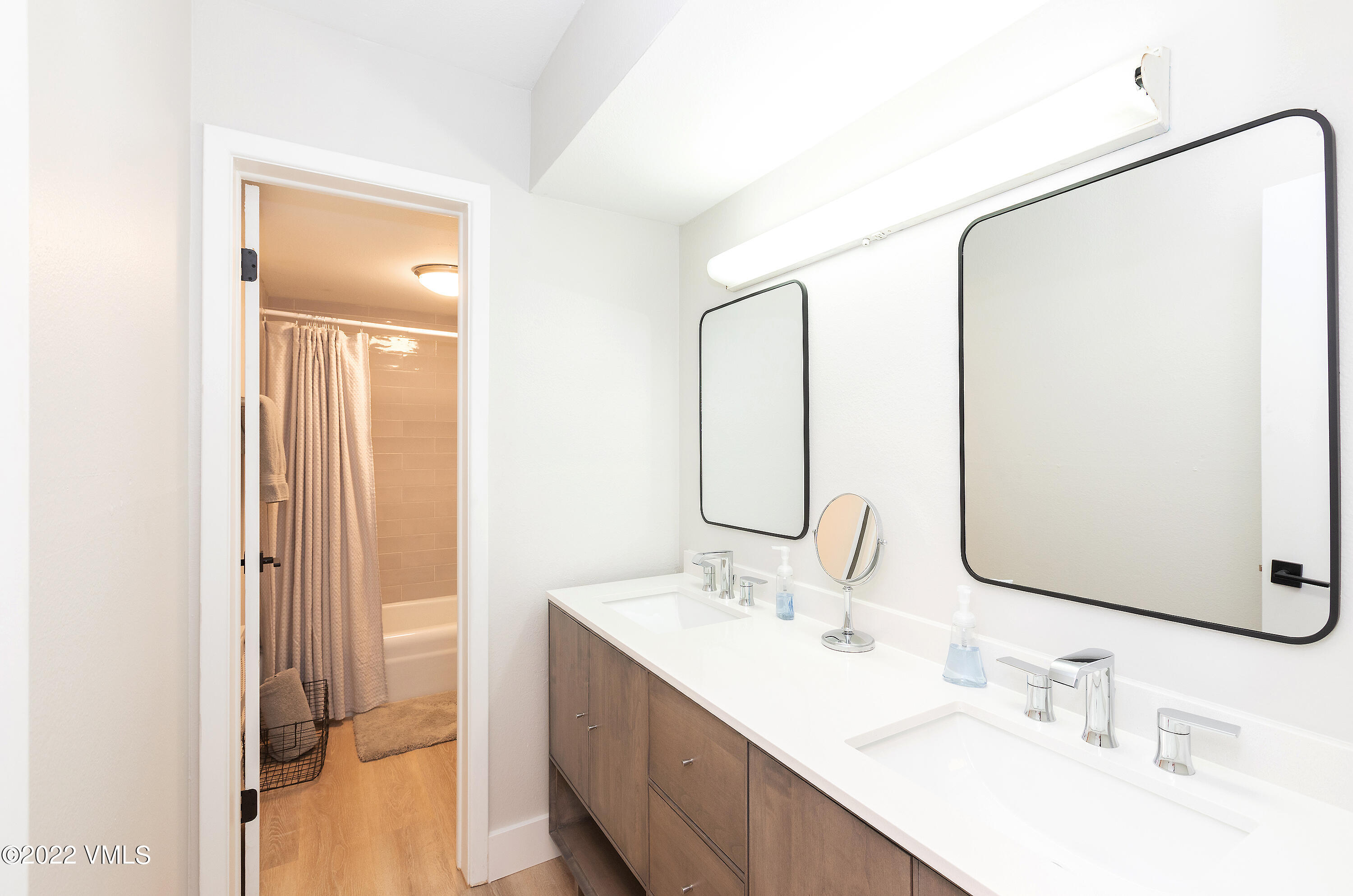 980 Vail View Drive, Unit 111B Vail, CO 81657 - Photo 13 of 17 a bathroom with a double vanity sink mirror and