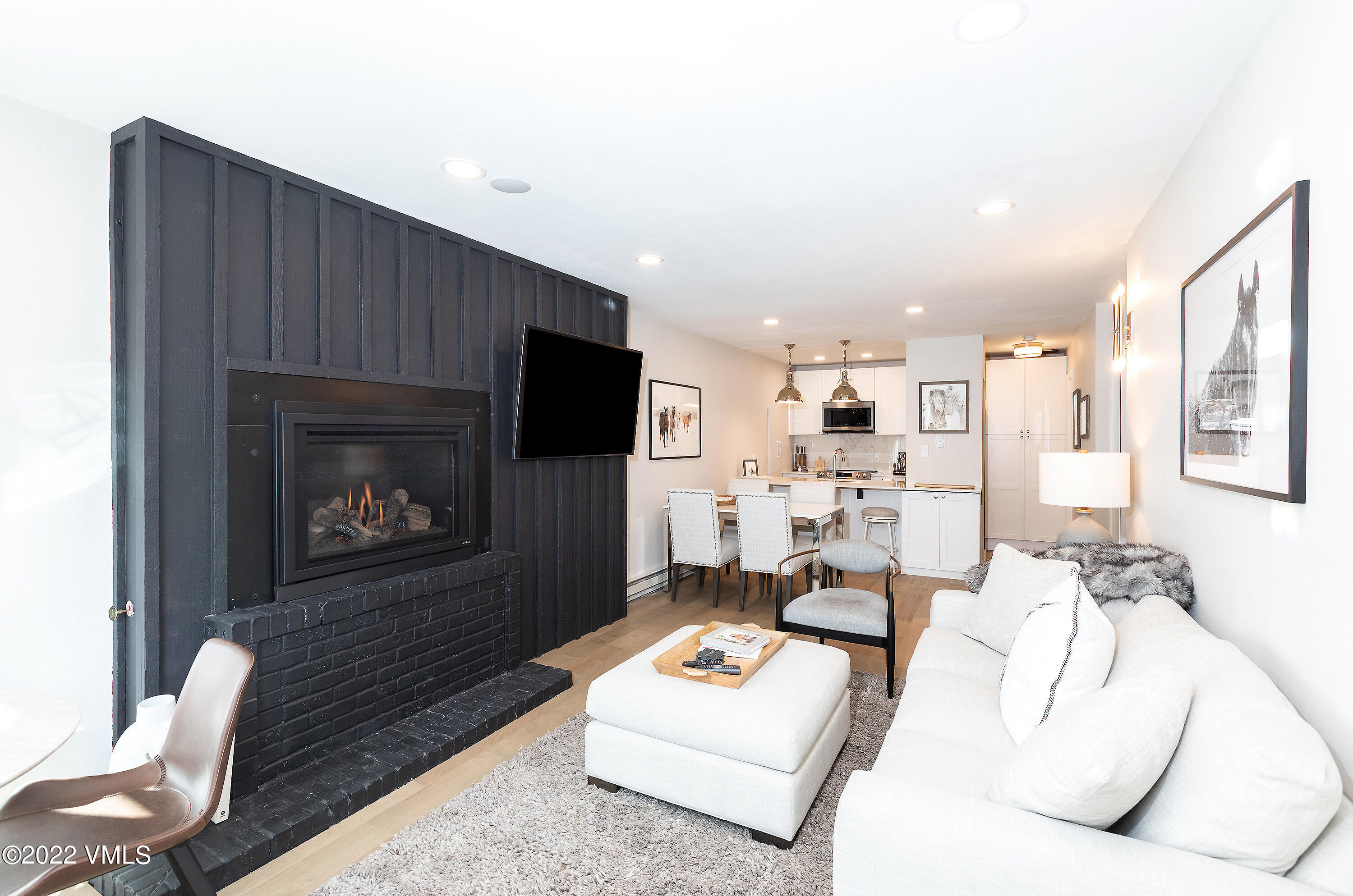 980 Vail View Drive, Unit 111B Vail, CO 81657 - Photo 3 of 17 a living room with furniture and a flat screen tv