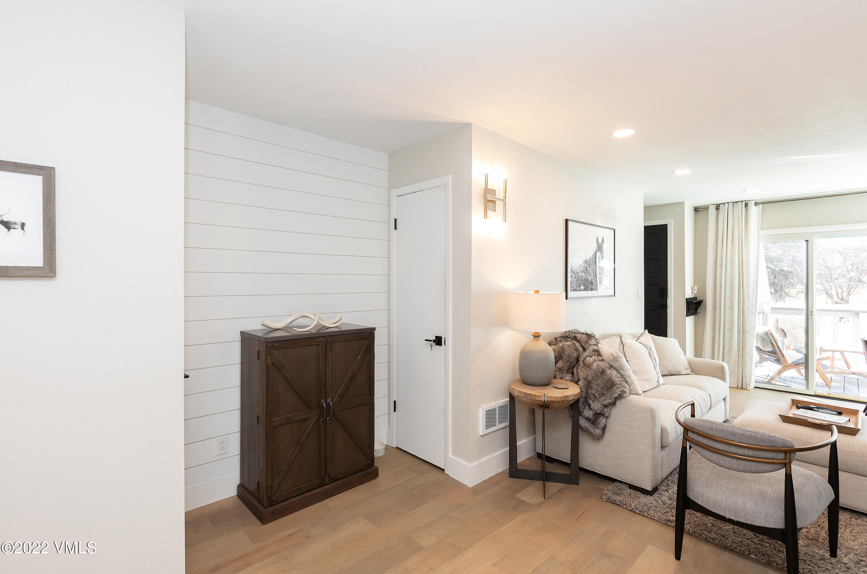 980 Vail View Drive, Unit 111B Vail, CO 81657 - Photo 6 of 17 a living room with furniture and wooden floor