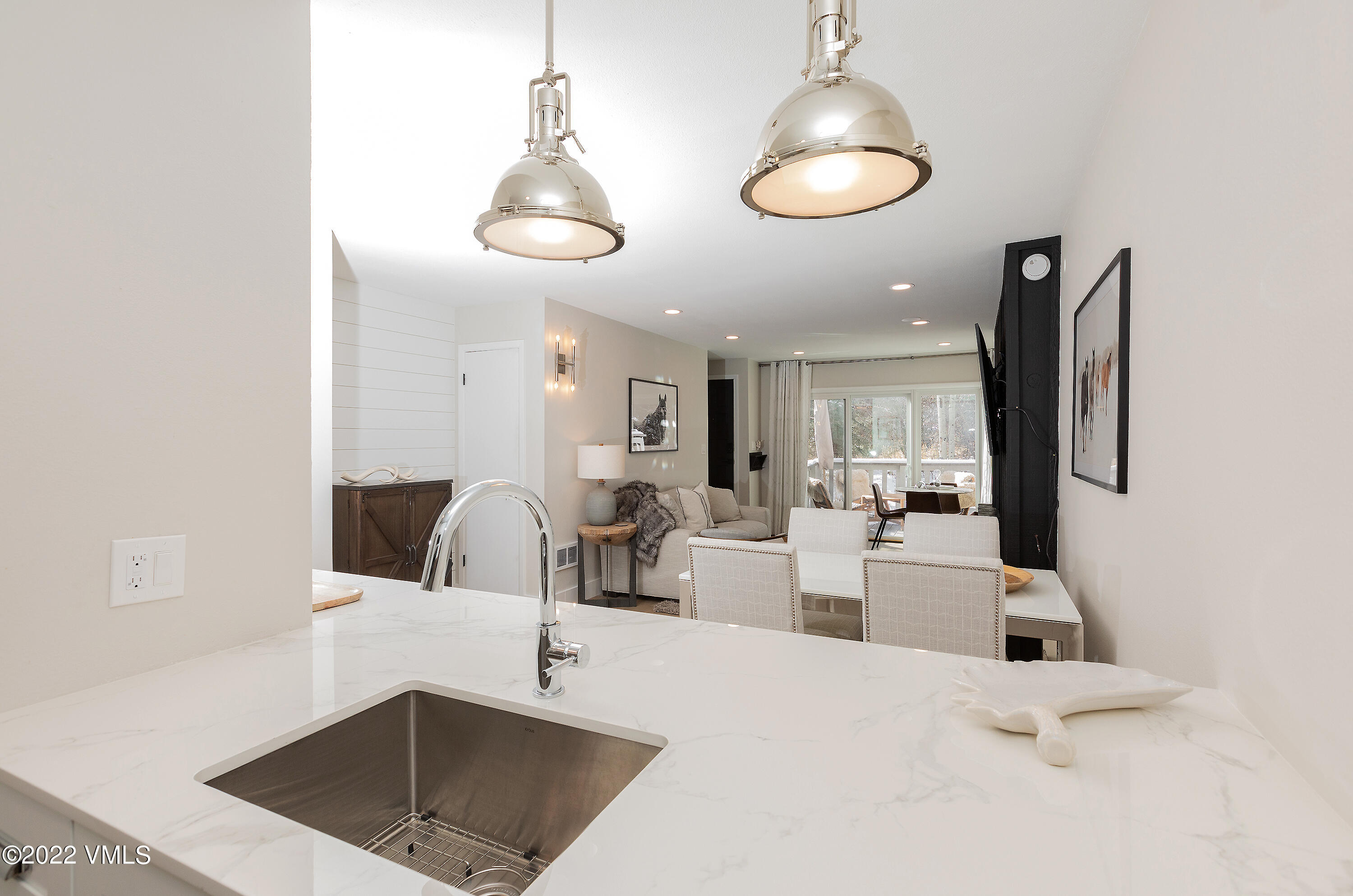 980 Vail View Drive, Unit 111B Vail, CO 81657 - Photo 8 of 17 a view of living room with furniture and chandelier
